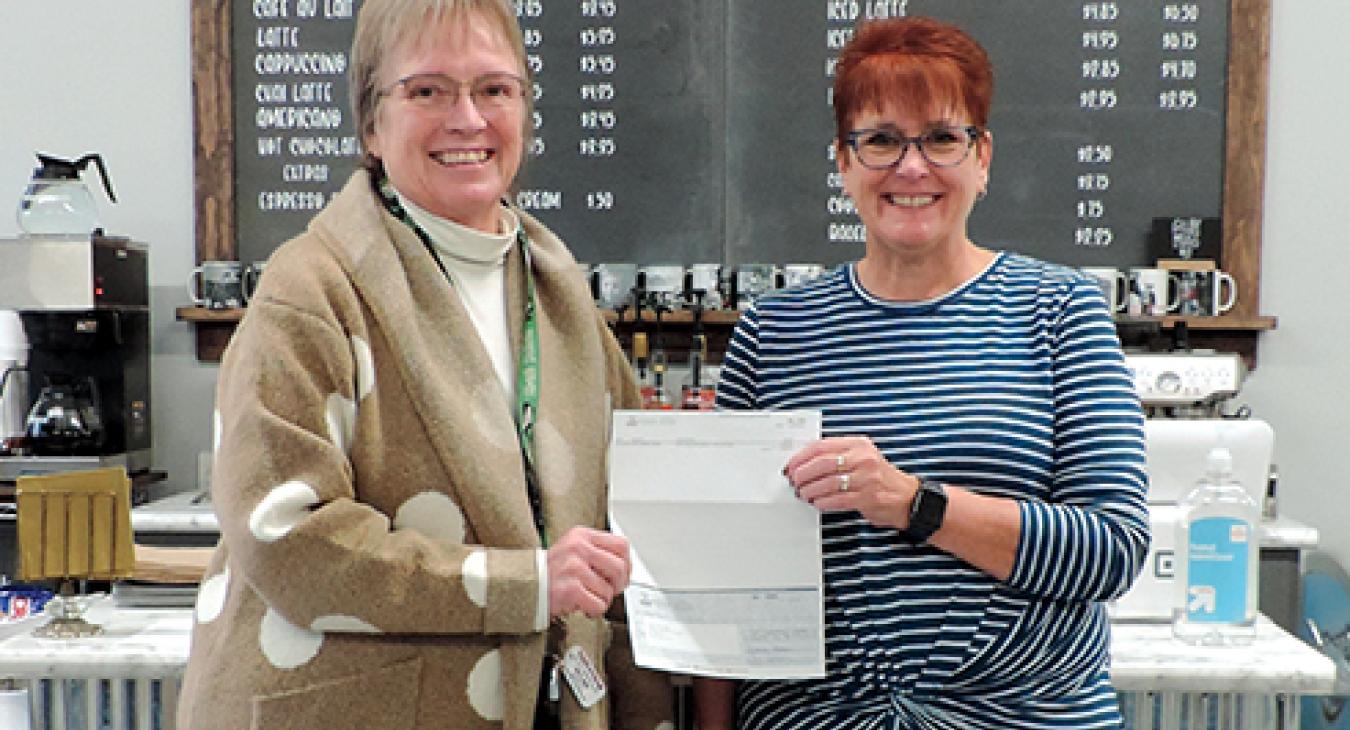 Nodak Electric Cooperative director Cheryl Osowski and Gilby city council member JoLynn Dickson.